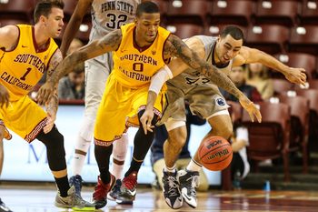 Nov 23, 2014; Charleston, SC, USA; USC Trojans forward Darion Clark (0) and Penn State Nittany Lions forward Ross Travis (43) fight for the ball during the second period at TD Arena. Mandatory Credit: Jim Dedmon-Imagn Images