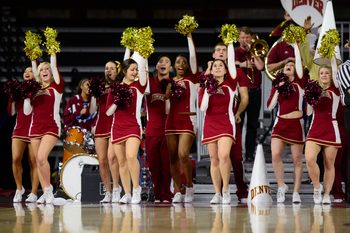 Dec 19, 2014; Denver, CO, USA; Denver Pioneers cheerleaders perform on the sidelines in the first half against the Colorado State Rams at Magness Arena. Mandatory Credit: Ron Chenoy-Imagn Images