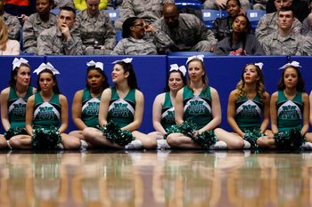 Mar 17, 2015; Dayton, OH, USA; Manhattan Jaspers cheerleaders sit court side during the first half against the Hampton Pirates in the first round of the 2015 NCAA Tournament at UD Arena. Mandatory Credit: Rick Osentoski-Imagn Images