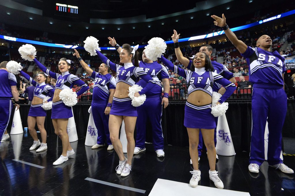 Mar 19, 2015; Portland, OR, USA; Stephen F. Austin Lumberjacks cheerleaders perform against the Utah Utes during the first half in the second round of the 2015 NCAA Tournament at Moda Center. Mandatory Credit: Kirby Lee-Imagn Images