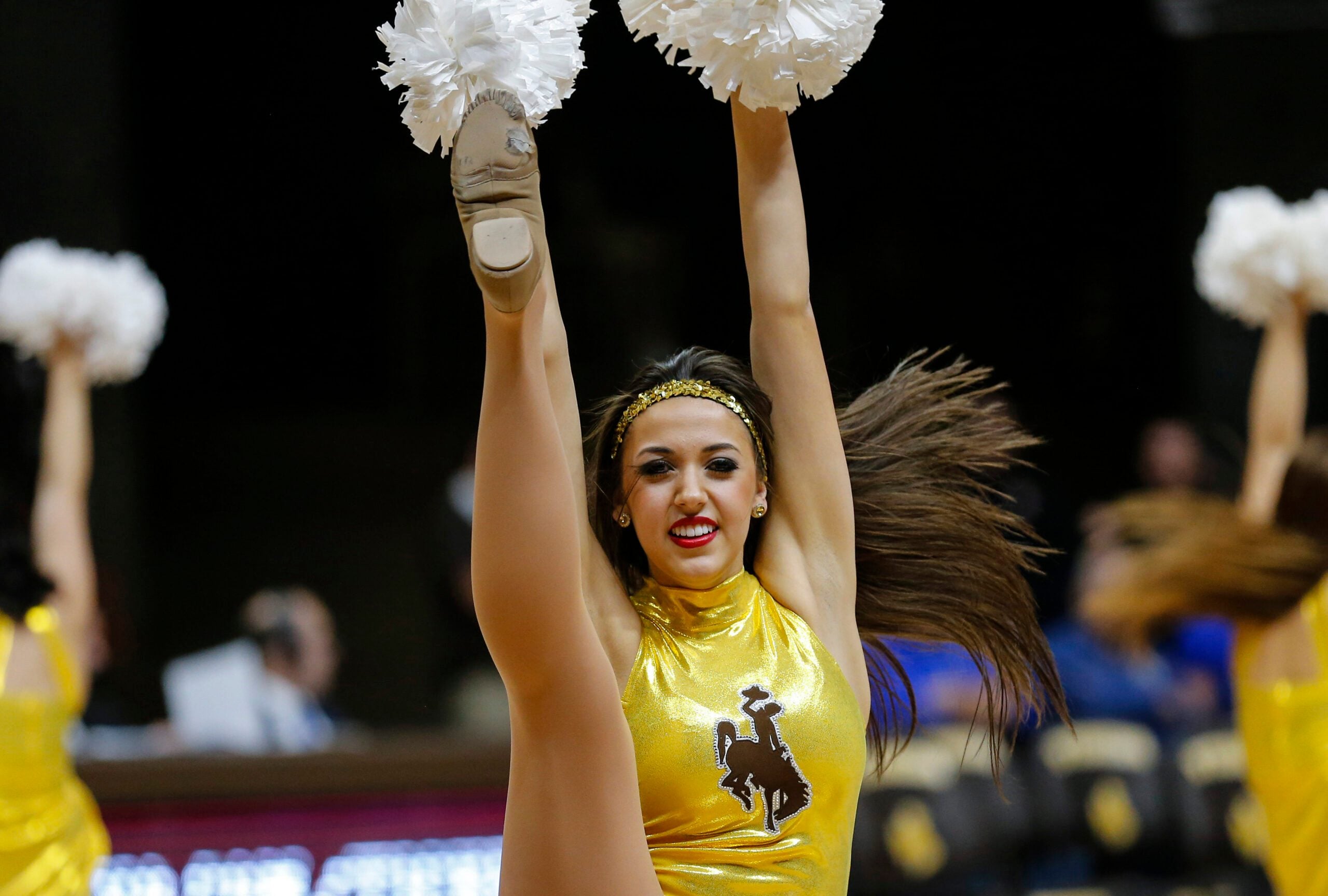 Jan 6, 2016; Laramie, WY, USA; A Wyoming Cowboys cheerleader performs against the Air Force Falcons during the second half at Arena-Auditorium. The Cowboys beat the Falcons 64-52. Mandatory Credit: Troy Babbitt-Imagn Images