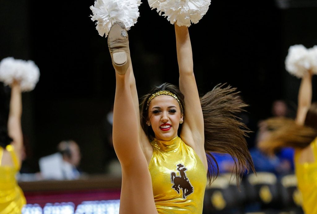 Jan 6, 2016; Laramie, WY, USA; A Wyoming Cowboys cheerleader performs against the Air Force Falcons during the second half at Arena-Auditorium. The Cowboys beat the Falcons 64-52. Mandatory Credit: Troy Babbitt-Imagn Images
