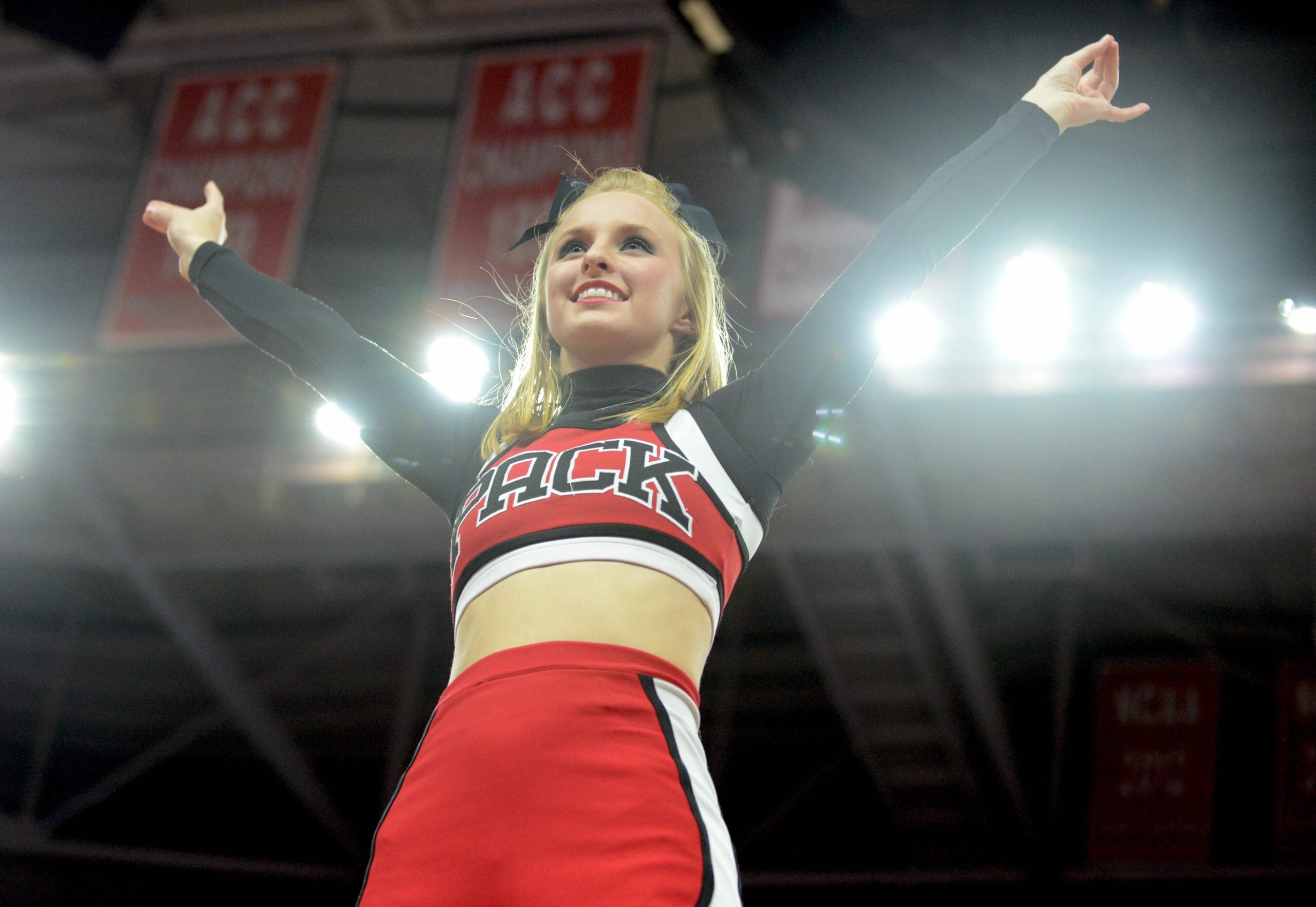 Feb 24, 2016; Raleigh, NC, USA; A North Carolina State Wolfpack cheerleader performs prior to the first half against the North Carolina Tar Heels at PNC Arena. Mandatory Credit: Rob Kinnan-Imagn Images