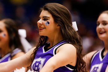 Mar 16, 2016; Dayton, OH, USA; Holy Cross Crusaders cheerleader performs during the first half against the Southern University Jaguars of the First Four of the NCAA men's college basketball tournament at Dayton Arena. Mandatory Credit: Rick Osentoski-Imagn Images