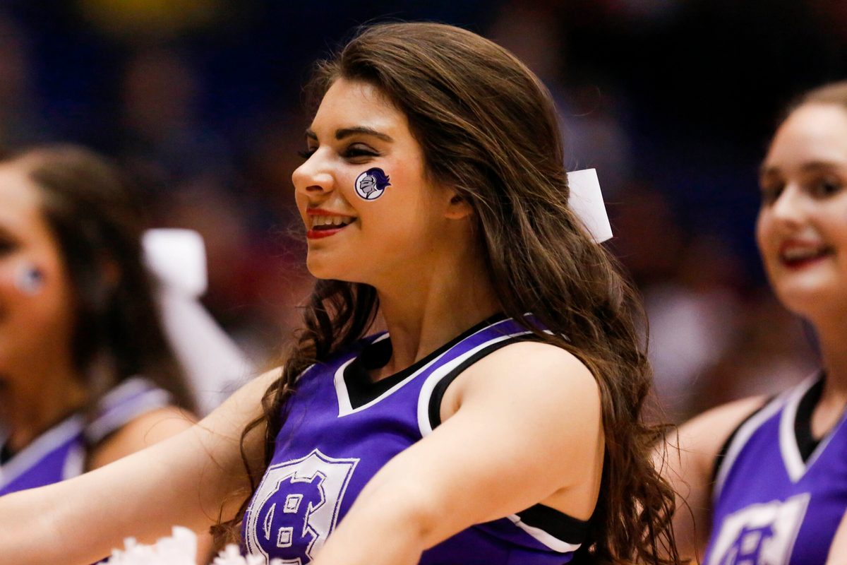 Mar 16, 2016; Dayton, OH, USA; Holy Cross Crusaders cheerleader performs during the first half against the Southern University Jaguars of the First Four of the NCAA men's college basketball tournament at Dayton Arena. Mandatory Credit: Rick Osentoski-Imagn Images