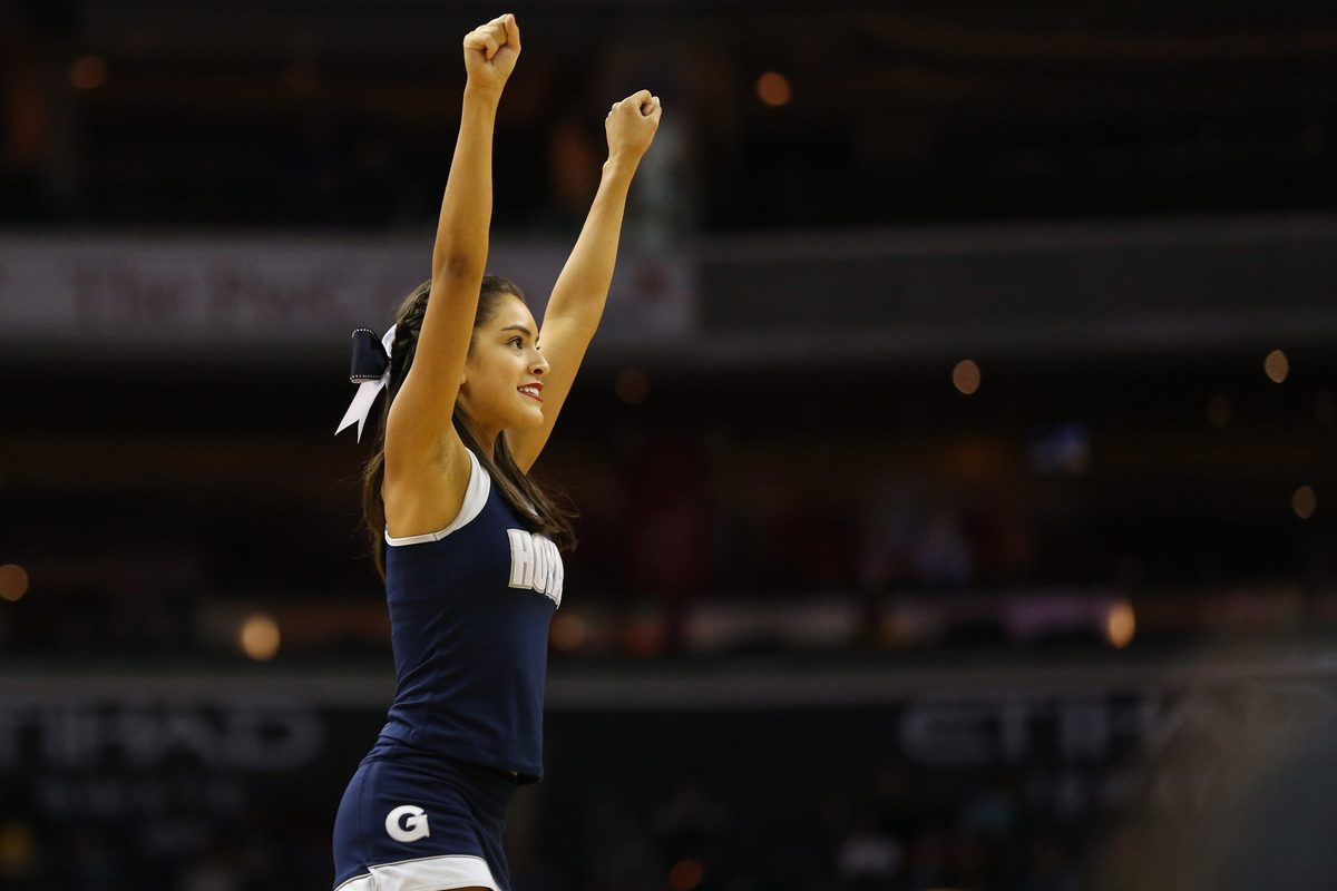 Feb 11, 2017; Washington, DC, USA; A Georgetown Hoyas cheerleader waves to fans in the stands during a timeout against the Marquette Golden Eagles in the second half at Verizon Center. The Hoyas won 80-62. Mandatory Credit: Geoff Burke-Imagn Images