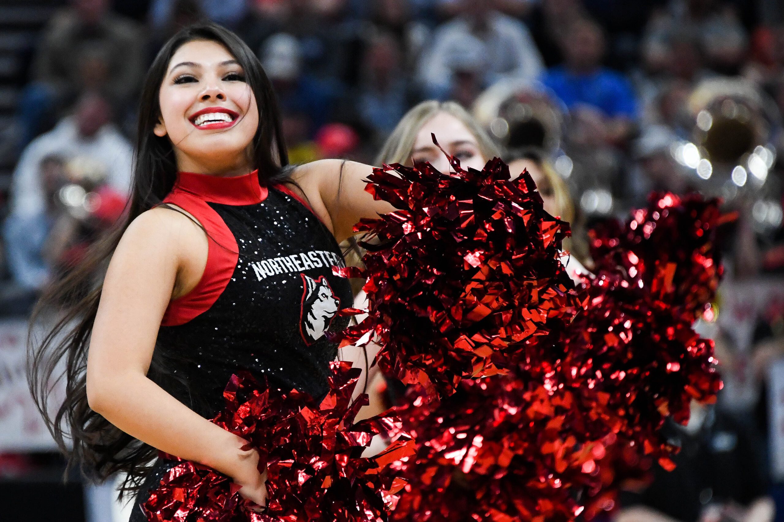 Mar 21, 2019; Salt Lake City, UT, USA; Northeastern Huskies cheerleaders perform during the first half in the first round of the 2019 NCAA Tournament against the Kansas Jayhawks at Vivint Smart Home Arena. Mandatory Credit: Kirby Lee-Imagn Images