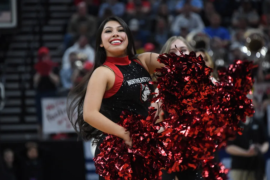 Mar 21, 2019; Salt Lake City, UT, USA; Northeastern Huskies cheerleaders perform in the first round of the 2019 NCAA Tournament against the Kansas Jayhawks at Vivint Smart Home Arena. Kansas defeated Northeastern 87-53. Mandatory Credit: Kirby Lee-Imagn Images