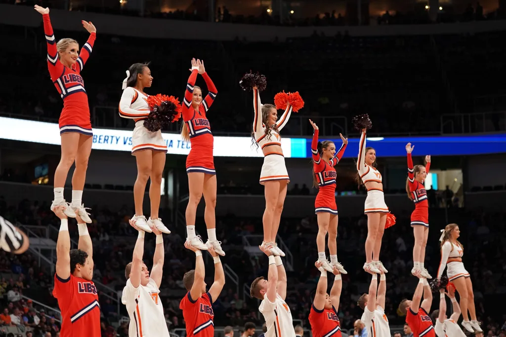 Mar 24, 2019; San Jose, CA, USA; Liberty Flames and Virginia Tech Hokies cheerleaders perform during the first half in the second round of the 2019 NCAA Tournament at SAP Center. Mandatory Credit: Kyle Terada-Imagn Images