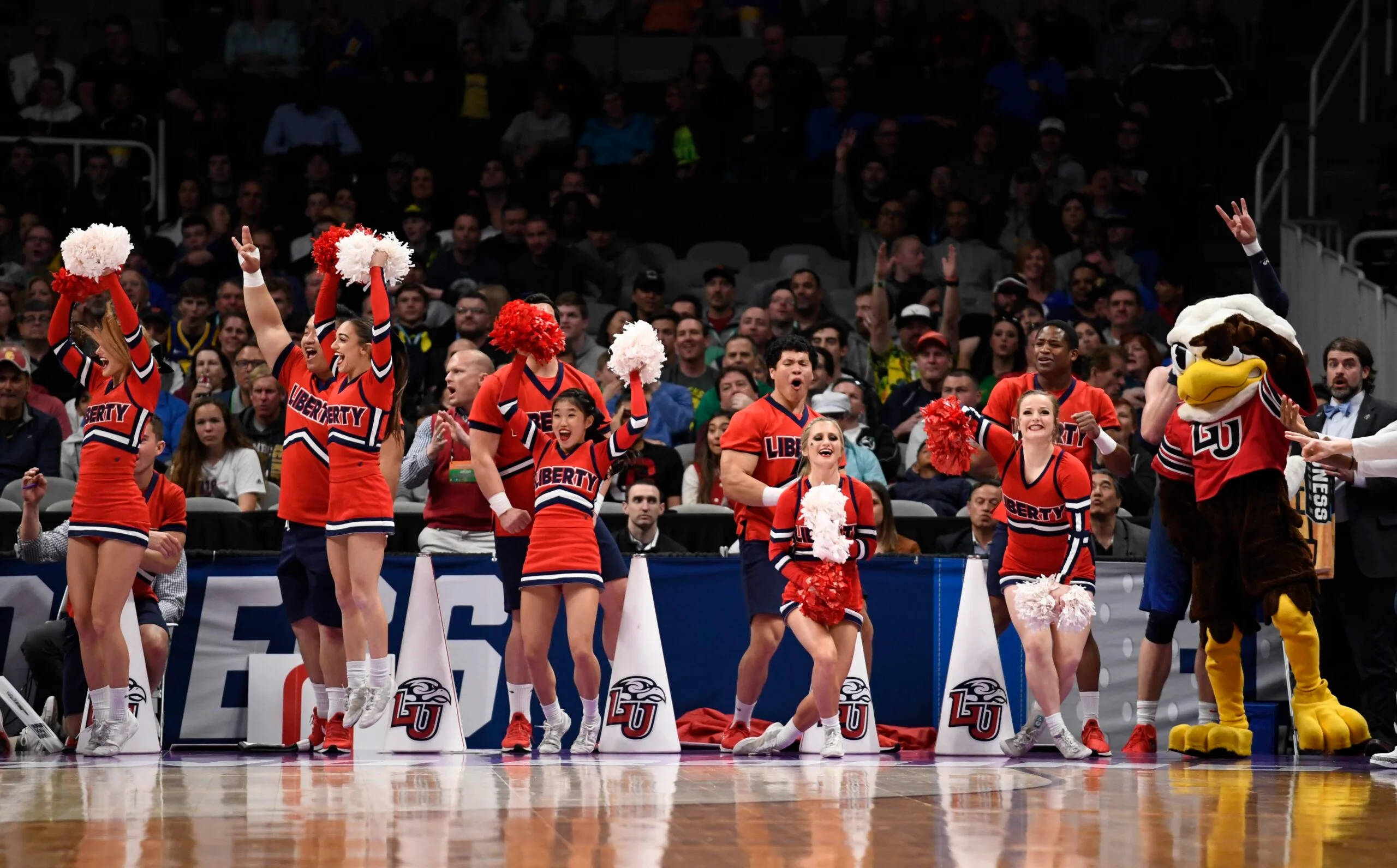 Mar 24, 2019; San Jose, CA, USA; Liberty Flames cheerleaders perform against the Virginia Tech Hokies during the first half in the second round of the 2019 NCAA Tournament at SAP Center. Mandatory Credit: Kelley L Cox-Imagn Images