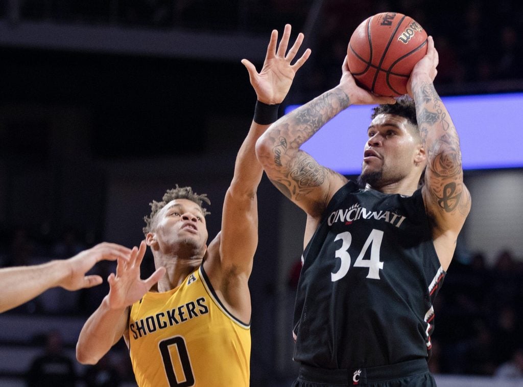 Cincinnati Bearcats guard Jarron Cumberland (34) shoots as Wichita State Shockers guard Dexter Dennis (0) guards in the second half of the NCAA men's basketball game on Sunday, Feb. 23, 2020, in Fifth Third Arena at the University of Cincinnati. Cincinnati Bearcats defeated Wichita State Shockers 67-64.
Cincinnati Bearcats Wichita State Shockers 256