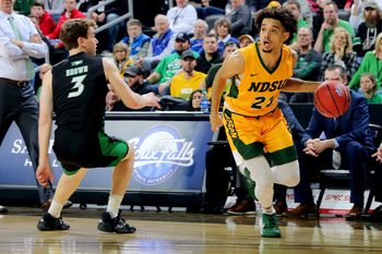 SIOUX FALLS, SD - MARCH 10: Jarius Cook #21 of the North Dakota State Bison drives baseline past Billy Brown #3 of the North Dakota Fighting Hawks during the men   s championship game at the 2020 Summit League Basketball Tournament in Sioux Falls, SD. (Photo by Dave Eggen/Inertia)

Summit League Basketball Tournament