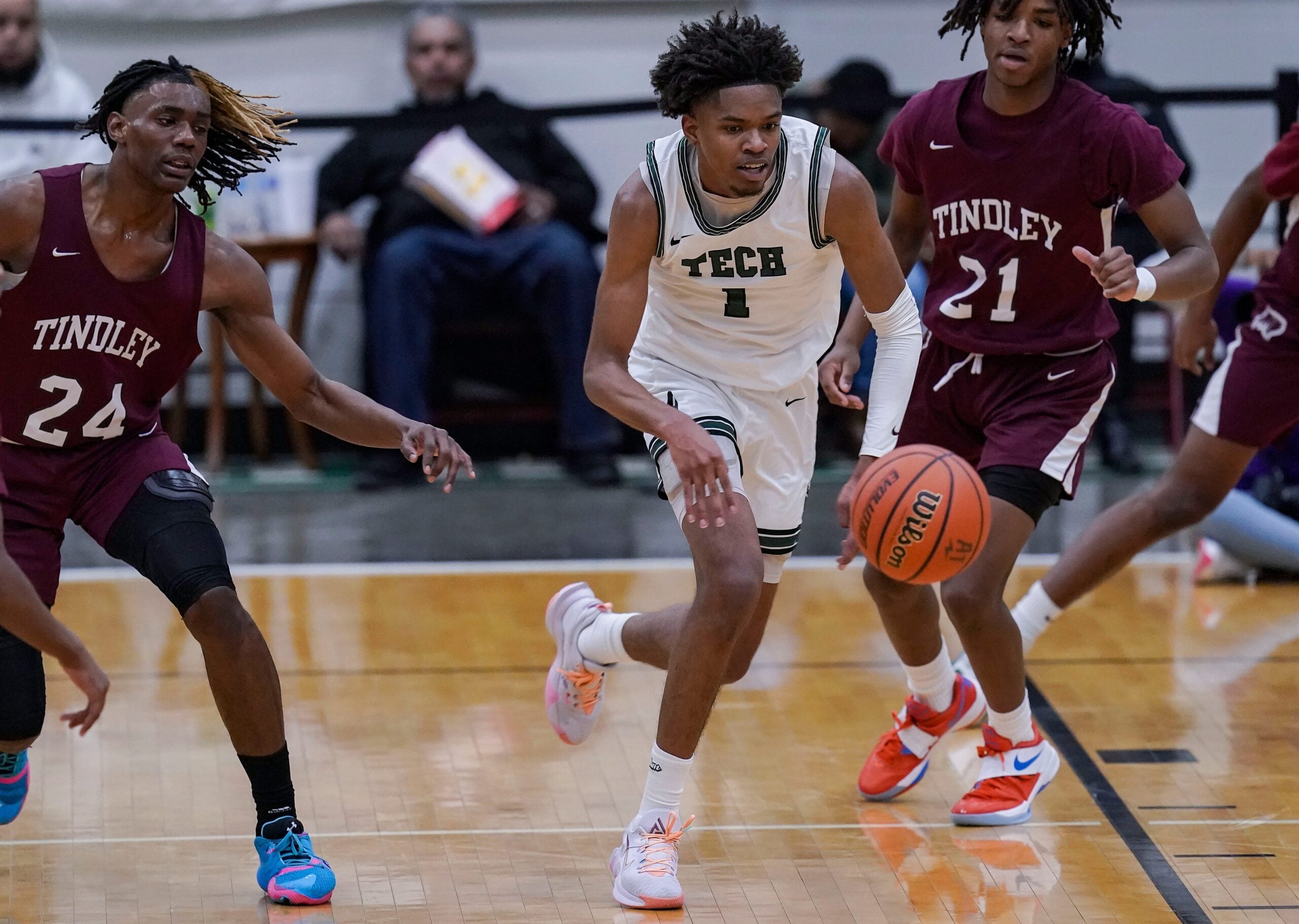 Arsenal Tech Titans guard Rasheed Jones (1) rushes after the ball against Tindley Tigers Jayden Pinkston (24) on Friday, Jan. 21, 2022, at Hamilton Southeastern in Fishers. The Arsenal Tech Titans defeated the Tindley Tigers in the semifinal for the City Tournament, 78-56.

Ini 0122 Hs Boys Basketball City Tournament Game 2 Arsenal Tech Titans Tindley Tigers