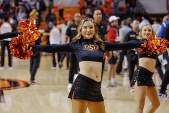 Dec 20, 2022; Stillwater, Oklahoma, USA; An Oklahoma State Cowboys cheerleader performs following their game against the Texas A&M-Corpus Christi Islanders at Gallagher-Iba Arena. Oklahoma State won 81-58. Mandatory Credit: Alonzo Adams-Imagn Images