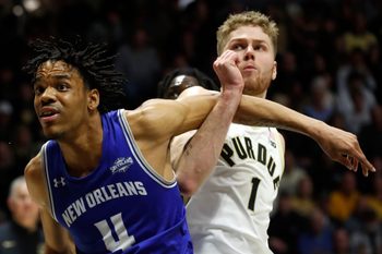 New Orleans Privateers forward Omarion Henry (4) boxes out Purdue Boilermakers forward Caleb Furst (1) during the NCAA men   s basketball game, Wednesday, Dec. 21, 2022, at Mackey Arena in West Lafayette, Ind. Purdue won 74-53.

Purduenombb122122 Am00807