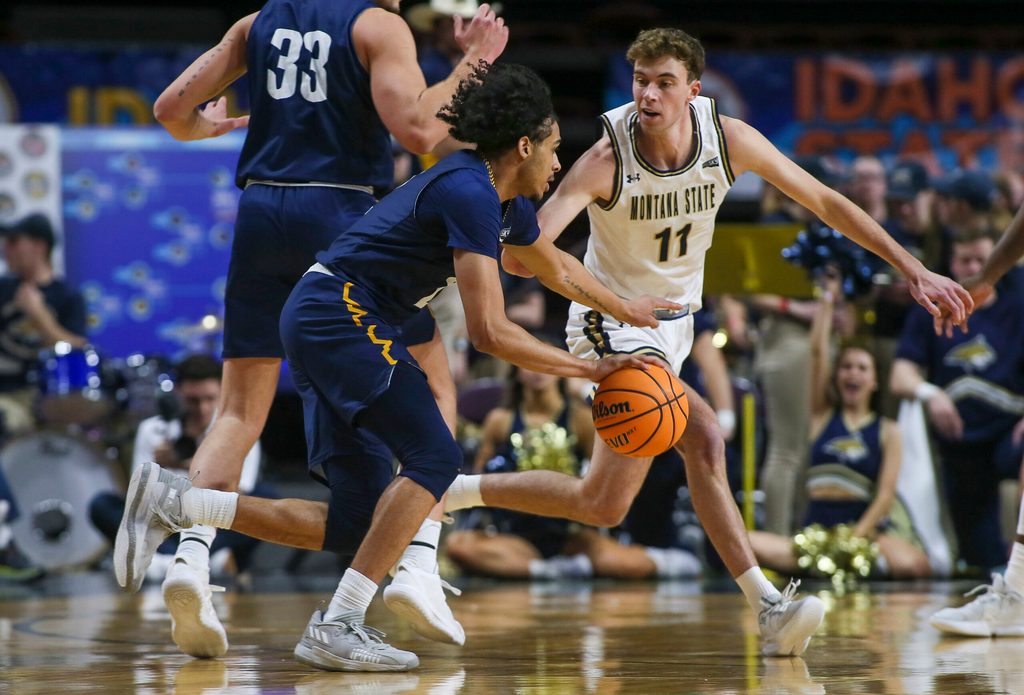 Mar 8, 2023; Boise, ID, USA; Montana State Bobcats guard Tyler Patterson (11) defends Northern Arizona Lumberjacks guard Xavier Fuller (2) during the first half at Idaho Central Arena. Mandatory Credit: Brian Losness-Imagn Images