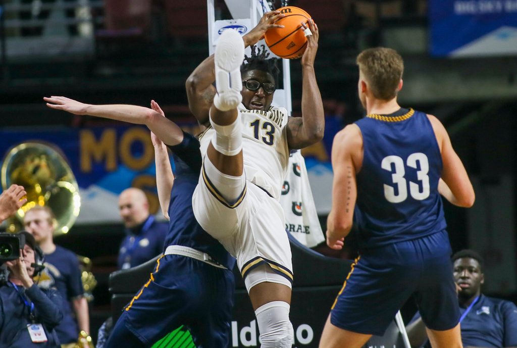 Mar 8, 2023; Boise, ID, USA; Montana State Bobcats forward Jubrile Belo (13) brings down a rebound during the second half against Northern Arizona Lumberjacks at Idaho Central Arena. Montana State defeated Northern Arizona 85-78. Mandatory Credit: Brian Losness-Imagn Images
