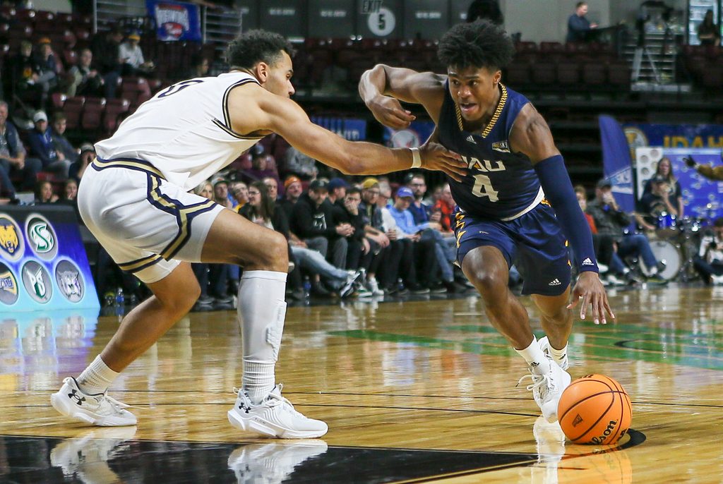 Mar 8, 2023; Boise, ID, USA; Northern Arizona Lumberjacks guard Oakland Fort (4) drives during the second half against Montana State Bobcats at Idaho Central Arena. Montana State defeated Northern Arizona 85-78. Mandatory Credit: Brian Losness-Imagn Images
