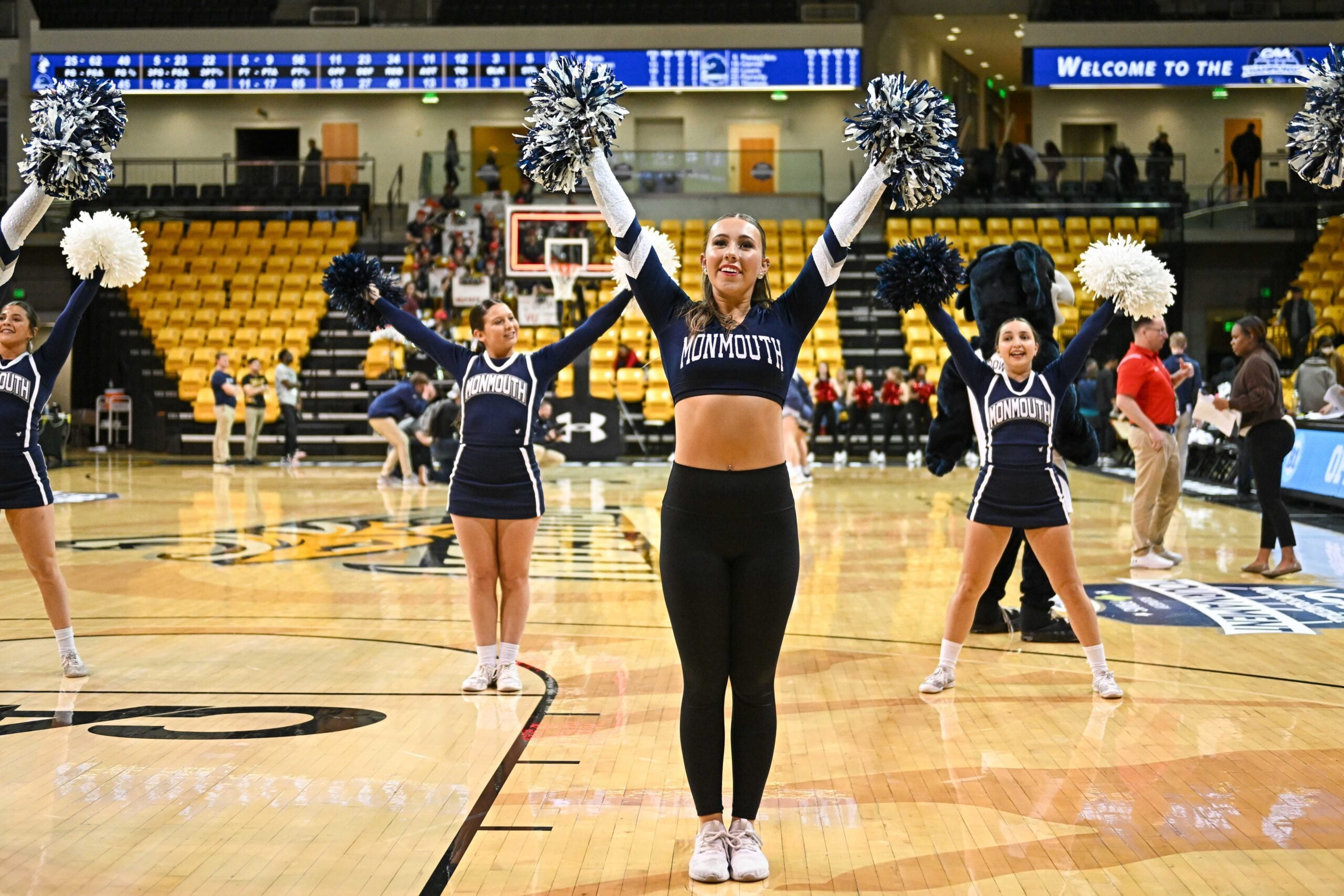 Mar 11, 2023; Towson, MD, USA; Monmouth Hawks cheerleaders cheer during the fourth quarter against the Northeastern Huskies at SECU Arena. Mandatory Credit: Emorej (Reggie) Hildred-Imagn Images