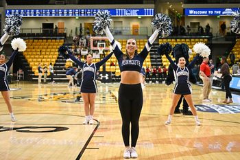 Mar 11, 2023; Towson, MD, USA; Monmouth Hawks cheerleaders cheer during the fourth quarter against the Northeastern Huskies at SECU Arena. Mandatory Credit: Emorej (Reggie) Hildred-Imagn Images