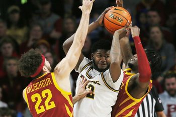 Iowa State University Cyclones guard Gabe Kalscheur (22) and forward Tre King (0) defend as Western Michigan Broncos center Titus Wright (22) looks for a pass during the first half at Hilton Coliseum Sunday, Dec.18, 2022, in Ames, Iowa. Photo by Nirmalendu Majumdar/Ames Tribune

Western Michigan And Iowa State Men S Basketball