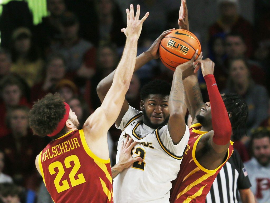 Iowa State University Cyclones guard Gabe Kalscheur (22) and forward Tre King (0) defend as Western Michigan Broncos center Titus Wright (22) looks for a pass during the first half at Hilton Coliseum Sunday, Dec.18, 2022, in Ames, Iowa. Photo by Nirmalendu Majumdar/Ames Tribune
Western Michigan And Iowa State Men S Basketball