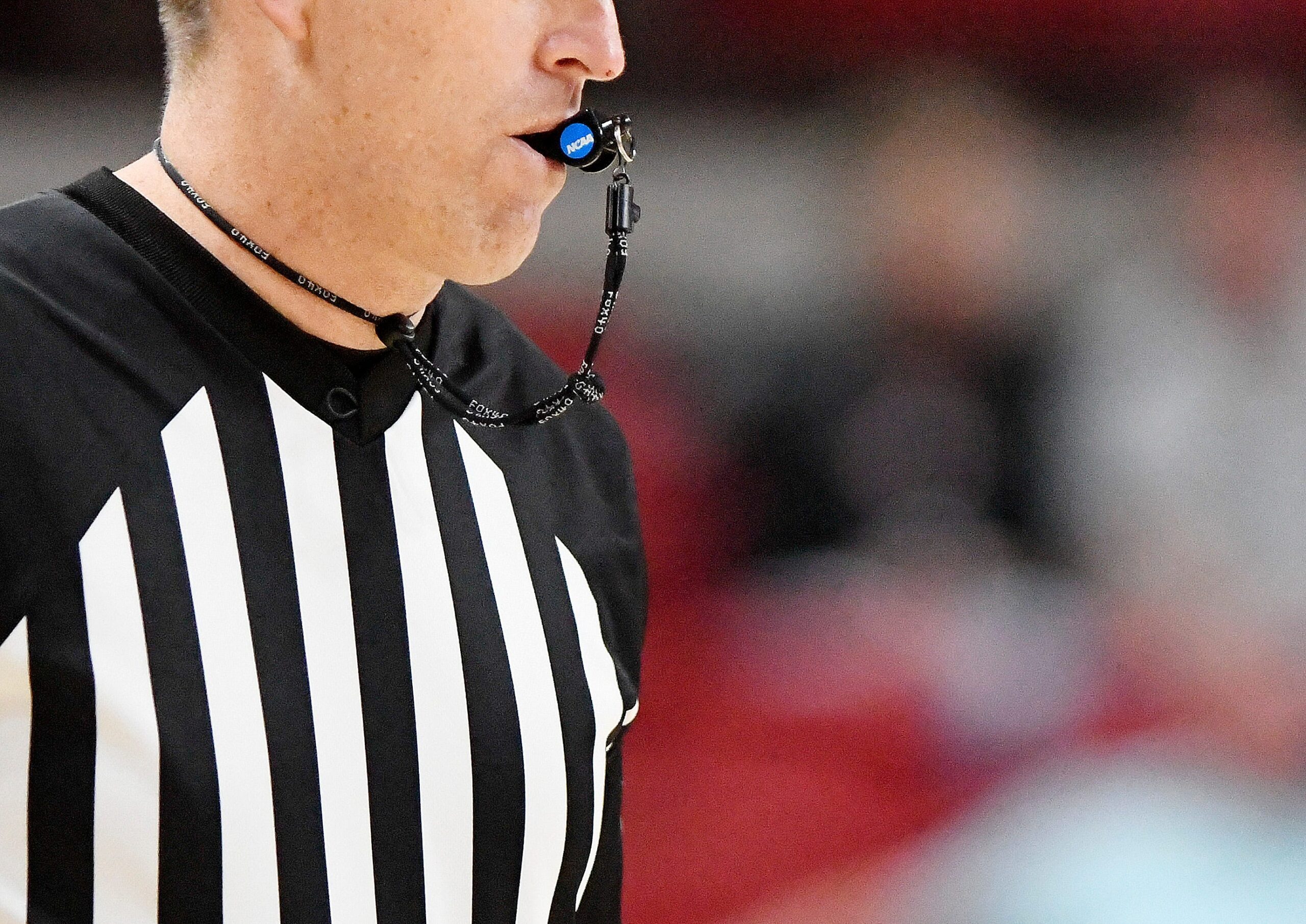 A referee blows a NCAA whistle during the Texas Tech non-conference basketball game against Omaha, Wednesday, Dec. 6, 2023, at United Supermarkets Arena.
