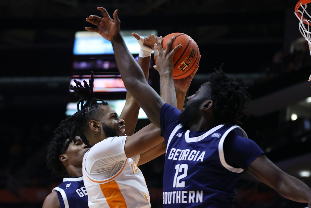 Dec 12, 2023; Knoxville, Tennessee, USA; Tennessee Volunteers forward Jonas Aidoo (0) goes to the basket against Georgia Southern Eagles guard Tyren Moore (12) at Food City Center at Thompson-Boling Arena. Mandatory Credit: Randy Sartin-Imagn Images