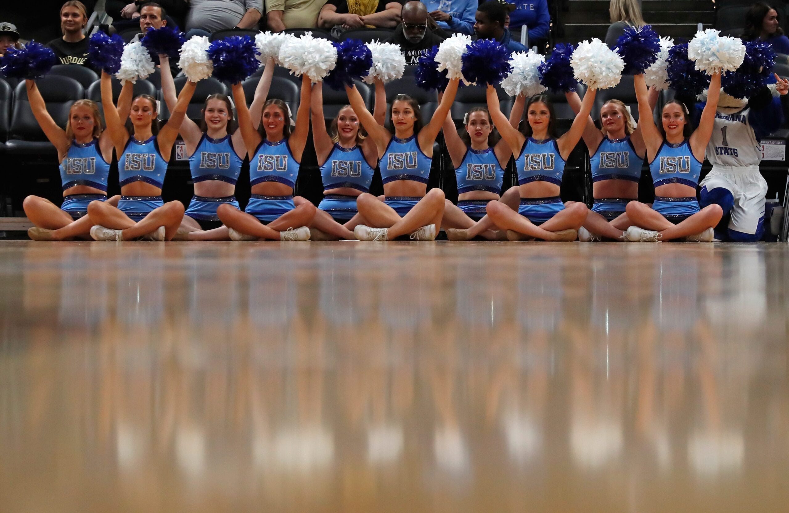 Indiana State Sycamores cheerleaders hold their pompoms up for a free throw during the NCAA men   s basketball game against the Ball State Cardinals, Saturday, Dec. 16, 2023, at Gainbridge Fieldhouse in Indianapolis.