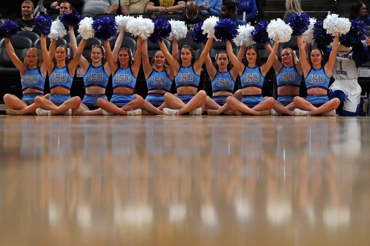Indiana State Sycamores cheerleaders hold their pompoms up for a free throw during the NCAA men s basketball game against the Ball State Cardinals, Saturday, Dec. 16, 2023, at Gainbridge Fieldhouse in Indianapolis.