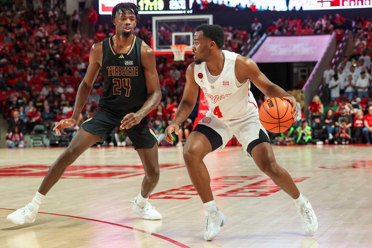 Dec 21, 2023; Houston, Texas, USA; Houston Cougars guard L.J. Cryer (4) dribbles against Texas State Bobcats forward Brandon Love (24) in the second half at Fertitta Center. Mandatory Credit: Thomas Shea-Imagn Images