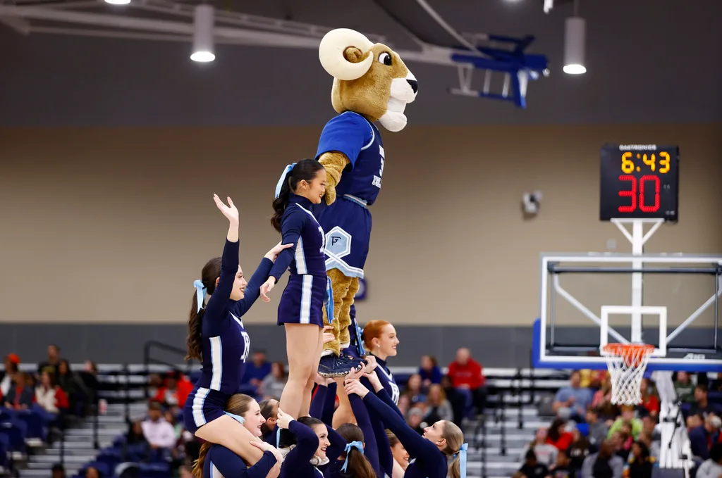 Mar 10, 2024; Henrico, VA, USA; Rhode Island Rams cheerleaders perform on the court during a stoppage in play in the first half at Henrico Sports & Events Center. Mandatory Credit: Amber Searls-Imagn Images