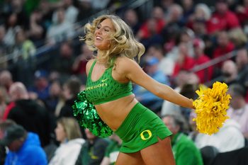 Mar 14, 2024; Las Vegas, NV, USA; Oregon Ducks cheerleaders perform in the first half against the UCLA Bruins at T-Mobile Arena. Mandatory Credit: Kirby Lee-Imagn Images