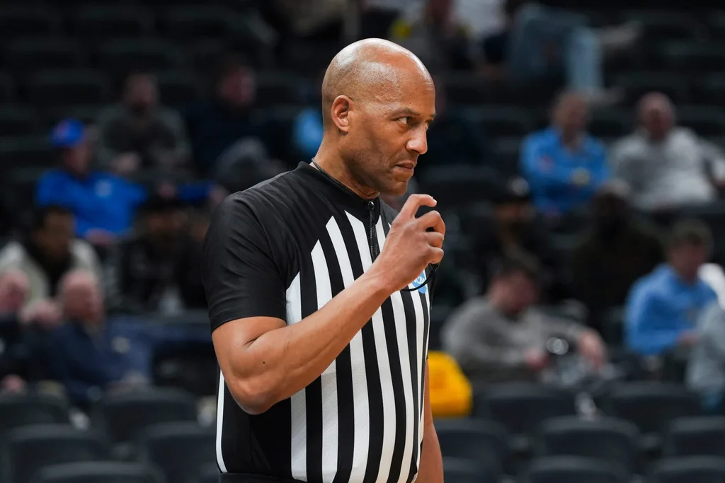 NCAA referee Bert Smith keeps his whistle at the ready Friday, March 22, 2024, during the first round of the NCAA Men’s Basketball Tournament at Gainbridge Fieldhouse in Indianapolis. The Colorado Buffaloes defeated the Florida Gators 102-100.