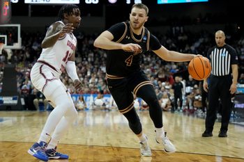 Mar 22, 2024; Spokane, WA, USA; Charleston Cougars guard Bryce Butler (4) dribbles against Alabama Crimson Tide guard Latrell Wrightsell Jr. (12) during the second half in the first round of the 2024 NCAA Tournament at Spokane Veterans Memorial Arena. Mandatory Credit: Kirby Lee-Imagn Images