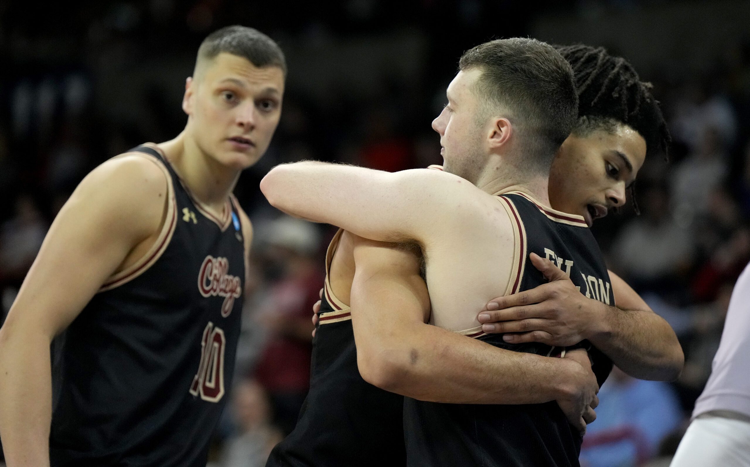 Mar 22, 2024; Spokane, WA, USA; Charleston Cougars forward Frankie Policelli (1) hugs guard CJ Fulton (12) during the second half in the first round of the 2024 NCAA Tournament against the Alabama Crimson Tide at Spokane Veterans Memorial Arena. Mandatory Credit: Kirby Lee-Imagn Images