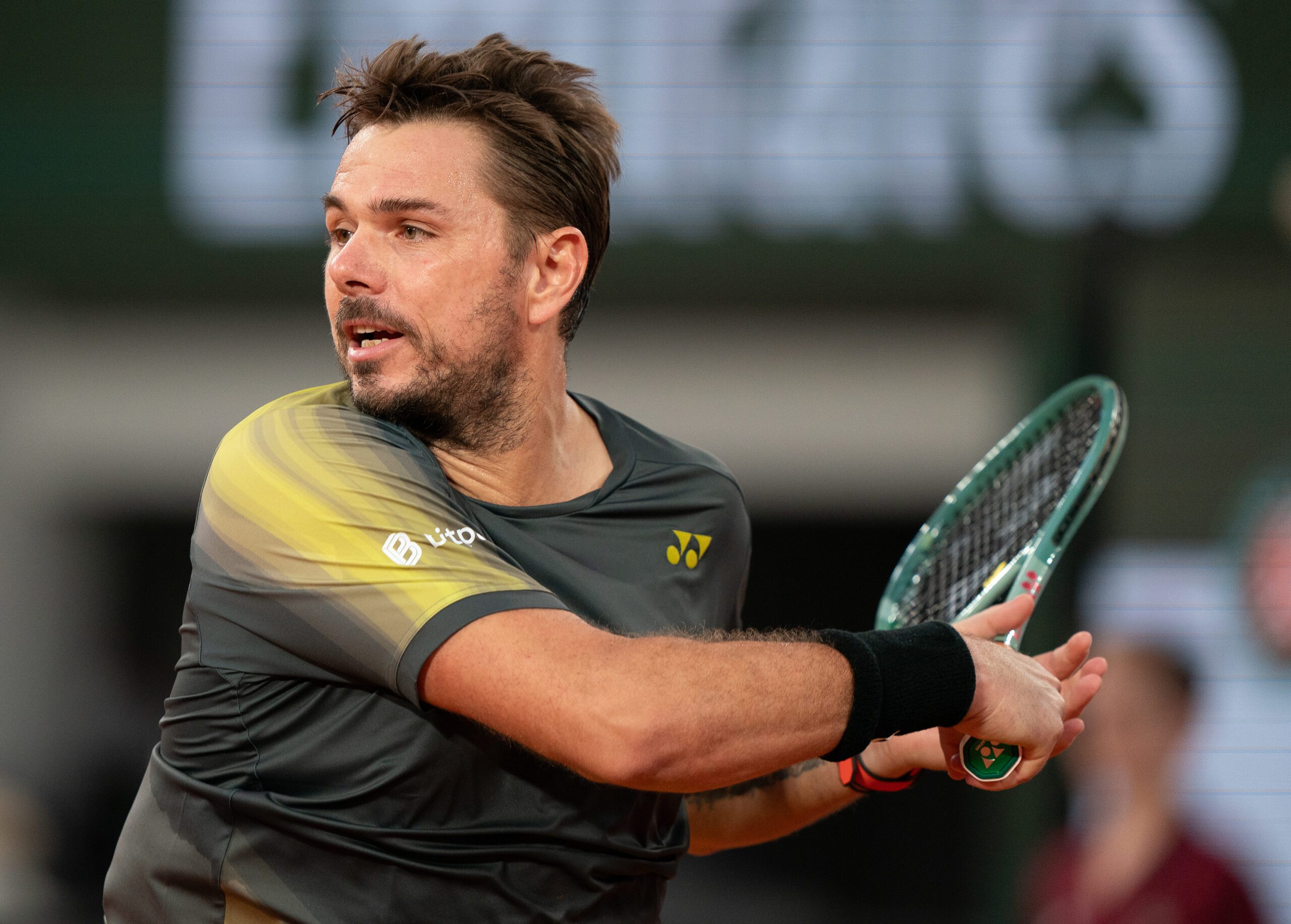 May 26, 2024; Paris, France; Stan Wawrinka of Switzerland returns a shot during his match against Andy Murray of Great Britain on day one of Roland Garros at Stade Roland Garros. Mandatory Credit: Susan Mullane-Imagn Images