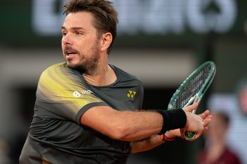 May 26, 2024; Paris, France; Stan Wawrinka of Switzerland returns a shot during his match against Andy Murray of Great Britain on day one of Roland Garros at Stade Roland Garros. Mandatory Credit: Susan Mullane-Imagn Images