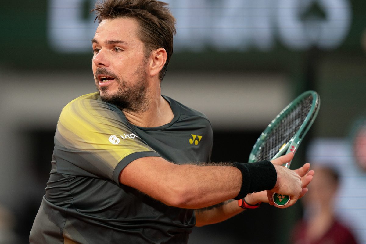 May 26, 2024; Paris, France; Stan Wawrinka of Switzerland returns a shot during his match against Andy Murray of Great Britain on day one of Roland Garros at Stade Roland Garros. Mandatory Credit: Susan Mullane-Imagn Images