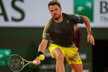 May 26, 2024; Paris, France; Stan Wawrinka of Switzerland returns a shot during his match against Andy Murray of Great Britain on day one of Roland Garros at Stade Roland Garros. Mandatory Credit: Susan Mullane-Imagn Images