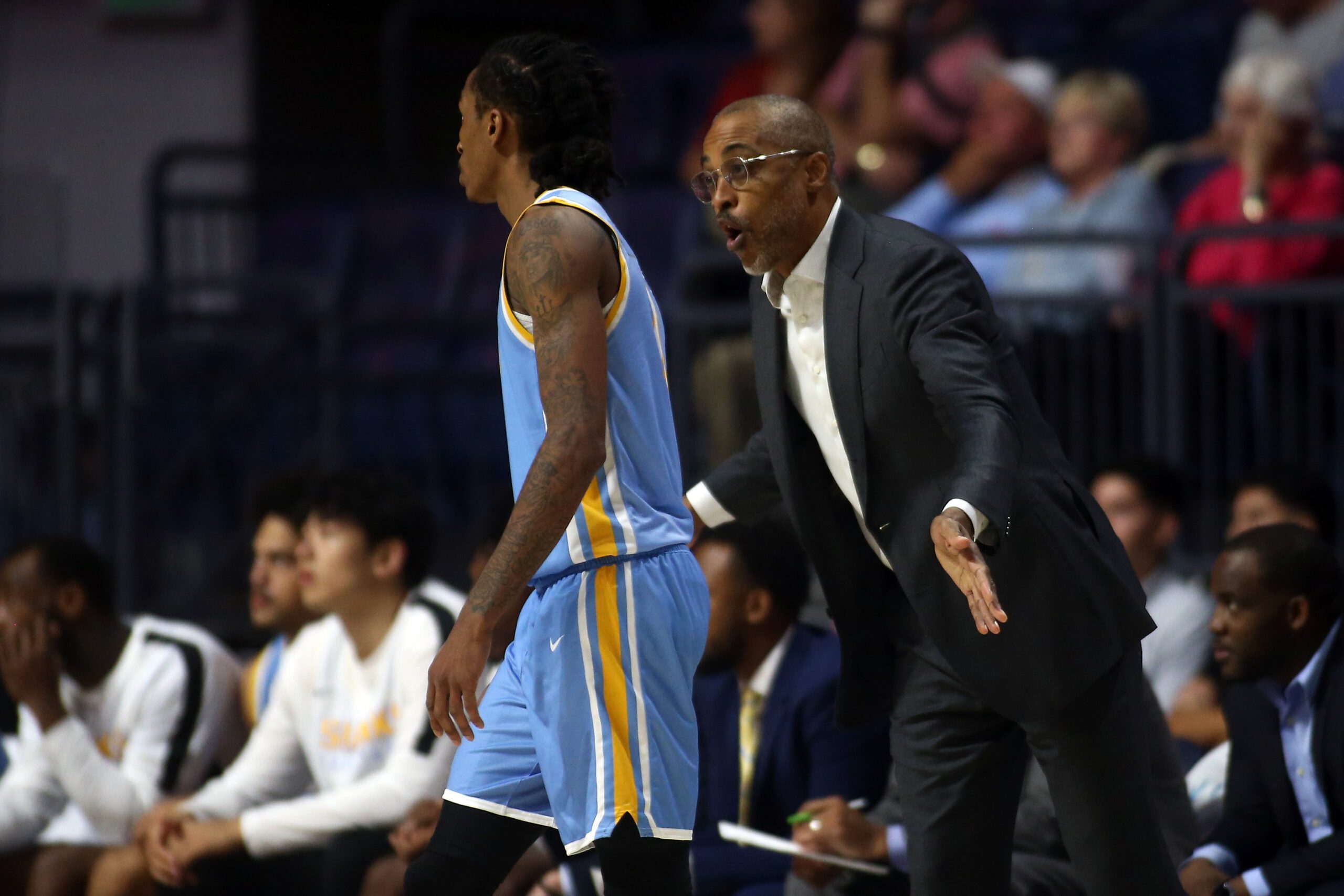 Nov 4, 2024; Oxford, Mississippi, USA; Long Island Sharks head coach Rod Strickland (right) talks with guard Malachi Davis (0) during the second half against the Mississippi Rebels at The Sandy and John Black Pavilion at Ole Miss. Mandatory Credit: Petre Thomas-Imagn Images
