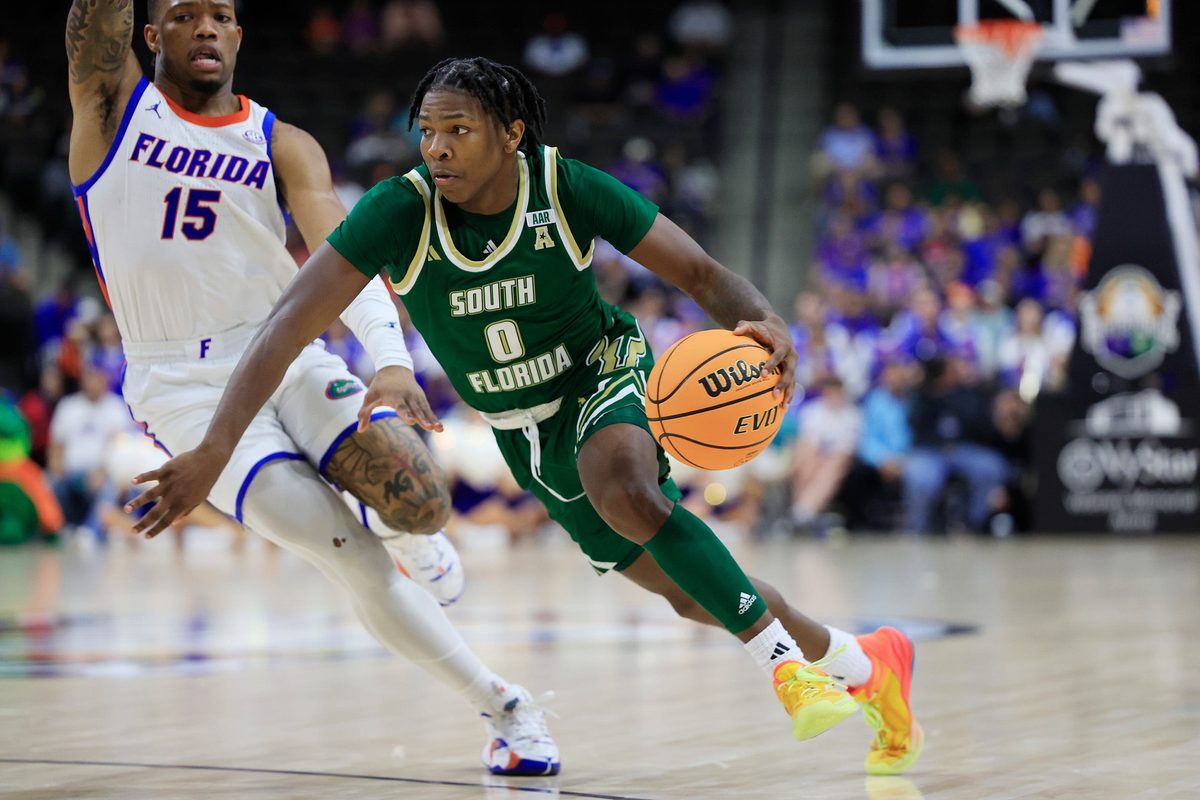 South Florida Bulls guard Jayden Reid (0) drives against Florida Gators guard Alijah Martin (15) during the second half of an NCAA men’s basketball matchup Monday, Nov. 4, 2024 at VyStar Veterans Memorial Arena in Jacksonville, Fla. Florida defeated South Florida 98-83. [Corey Perrine/Florida Times-Union]