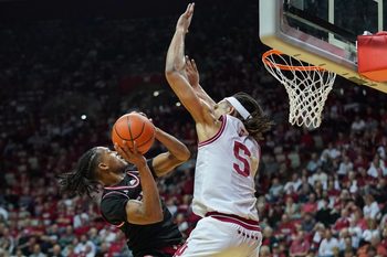 Nov 6, 2024; Bloomington, Indiana, USA; SIU Edwardsville Cougars guard Brian Taylor II (11) scores against Indiana Hoosiers forward Malik Reneau (5) during the second half at Simon Skjodt Assembly Hall. Mandatory Credit: Robert Goddin-Imagn Images