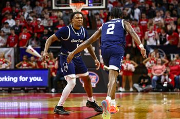 Nov 11, 2024; Piscataway, New Jersey, USA; St. Peter's Peacocks guard Marcus Randolph (2) celebrates after making a basket with guard Brent Bland (1) during the first half against the Rutgers Scarlet Knights at Jersey Mike's Arena. Mandatory Credit: Vincent Carchietta-Imagn Images