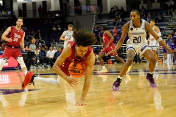 Nov 12, 2024; Evanston, Illinois, USA; Illinois-Chicago Flames guard Javon Jackson (22) steals the against the Northwestern Wildcats during the second half at Welsh-Ryan Arena. Mandatory Credit: David Banks-Imagn Images