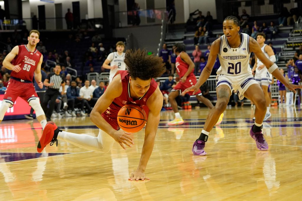 Nov 12, 2024; Evanston, Illinois, USA; Illinois-Chicago Flames guard Javon Jackson (22) steals the against the Northwestern Wildcats during the second half at Welsh-Ryan Arena. Mandatory Credit: David Banks-Imagn Images