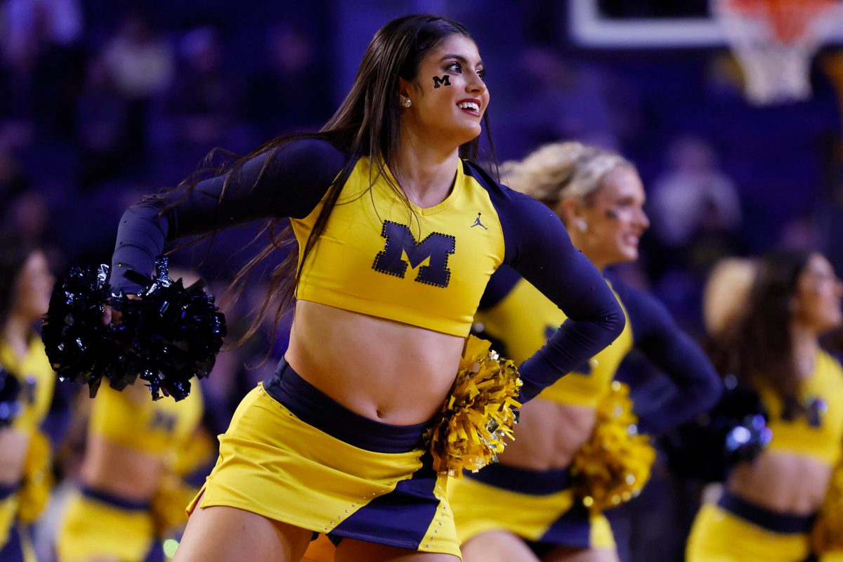 Nov 21, 2024; Ann Arbor, Michigan, USA;  Michigan Wolverines cheerleader cheer in the first half against the Tarleton Texans at Crisler Center. Mandatory Credit: Rick Osentoski-Imagn Images