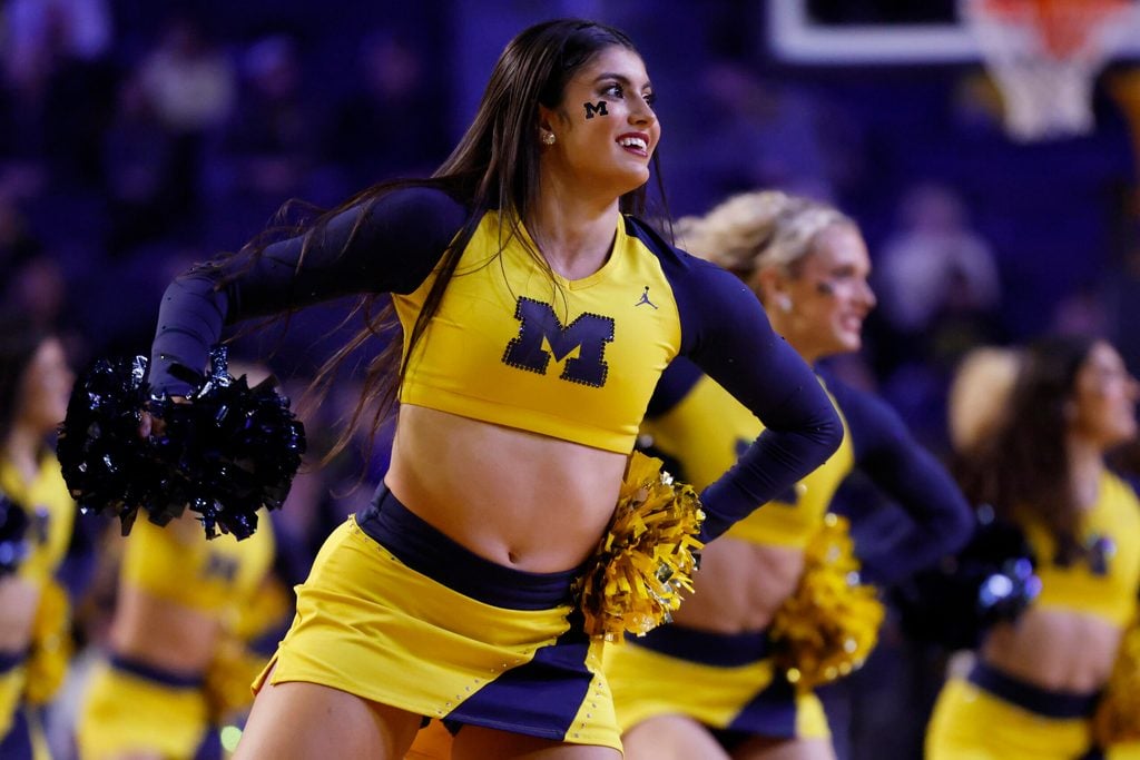 Nov 21, 2024; Ann Arbor, Michigan, USA; Michigan Wolverines cheerleader cheer in the first half against the Tarleton Texans at Crisler Center. Mandatory Credit: Rick Osentoski-Imagn Images