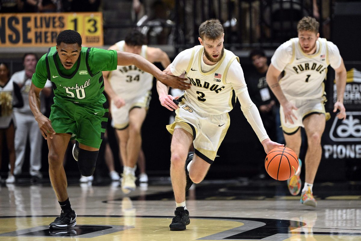 Nov 23, 2024; West Lafayette, Indiana, USA;  Marshall Thundering Herd guard Jalen Speer (50) defends Purdue Boilermakers guard Braden Smith (3) back after he stole the ball during the second half at Mackey Arena. Mandatory Credit: Marc Lebryk-Imagn Images