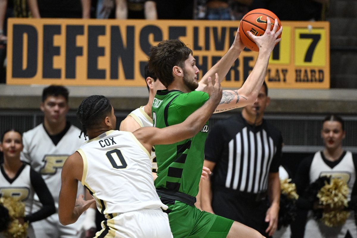 Nov 23, 2024; West Lafayette, Indiana, USA; Marshall Thundering Herd forward Wyatt Fricks (2) runs past Purdue Boilermakers guard C.J. Cox (0) during the second half at Mackey Arena. Mandatory Credit: Marc Lebryk-Imagn Images